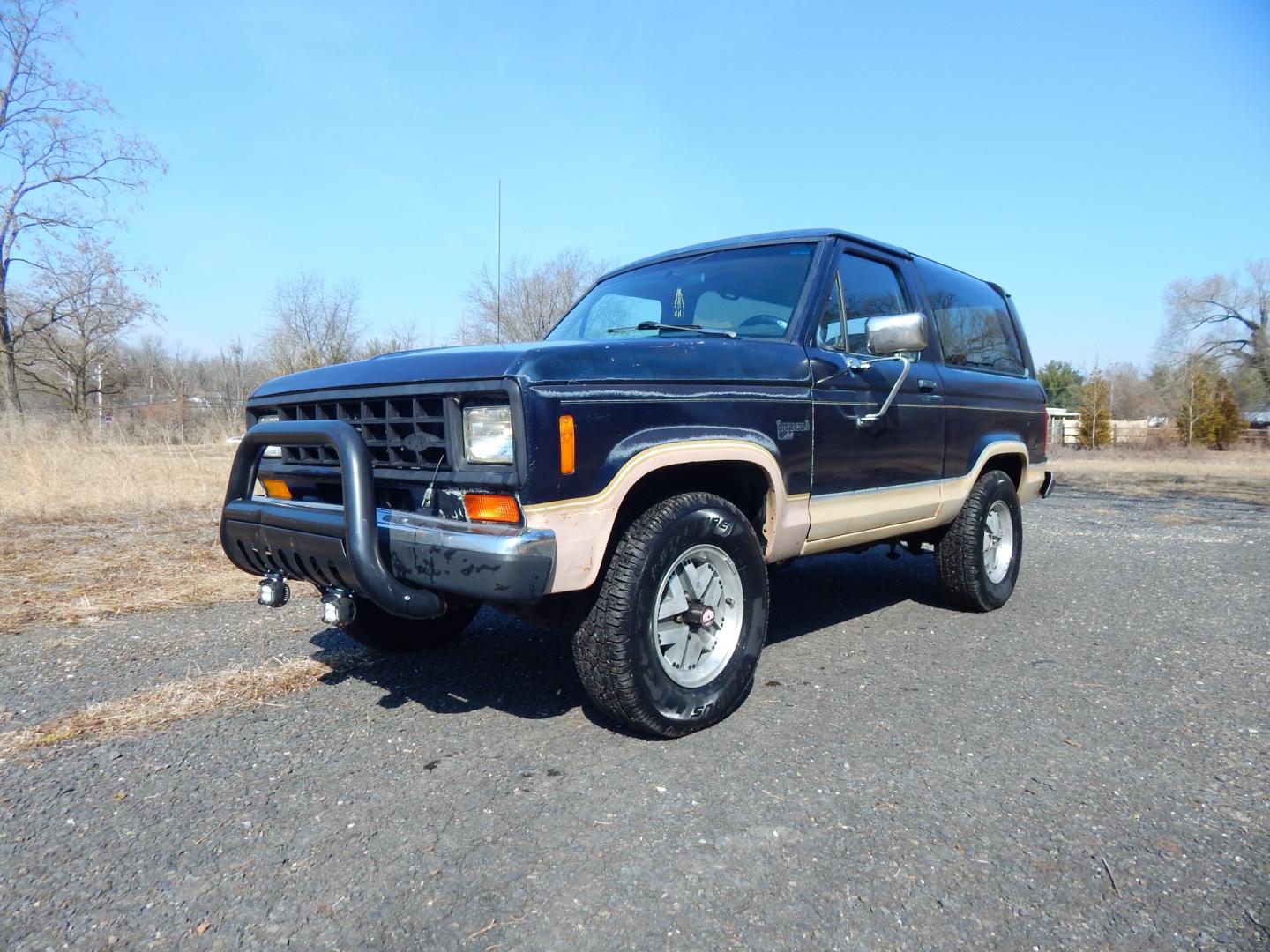 1988 Blue /Tan Ford Bronco II 4WD (1FMCU14T6JU) with an 2.9L V6 OHV 12V engine, 4-Speed Automatic Overdrive transmission, located at 6528 Lower York Road, New Hope, PA, 18938, (215) 862-9555, 40.358707, -74.977882 - Here we have a 1988 Ford Bronco 2 with a 2.9L V6 putting power to a 4x4 automatic transmission. Options include: tan cloth interior, heat/AC, XD Vision radio, power windows, cruise control, tilt steering wheel, front/rear defrost windows, spare tire cover, 15 inch alloy wheels with 4 Solarus AP tire - Photo#13